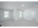 Spacious bonus room with carpet, neutral paint, large windows and an open layout at 770 Meadowbrook Ln, Summerville, SC 29486