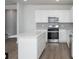 Bright kitchen features stainless appliances, an island and ample cabinets for storage at 770 Meadowbrook Ln, Summerville, SC 29486