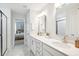 Elegant bathroom featuring double sinks, modern fixtures, and a glass-enclosed shower at 770 Opal Wing St, Moncks Corner, SC 29461