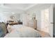 Bright bedroom featuring a sitting area, dresser, and ensuite bathroom for modern living at 770 Opal Wing St, Moncks Corner, SC 29461