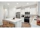 Well-lit kitchen with an island, stainless steel appliances, and plenty of cabinet space at 770 Opal Wing St, Moncks Corner, SC 29461