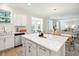 Bright, open kitchen layout with a central island connected to the dining and living areas at 770 Opal Wing St, Moncks Corner, SC 29461