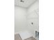 Clean, unfinished laundry room with white shelving and a tiled floor at 770 Opal Wing St, Moncks Corner, SC 29461