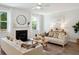 Bright and inviting living room with a cozy fireplace, stylish decor, and ample seating at 770 Opal Wing St, Moncks Corner, SC 29461