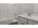 Well-lit bathroom features a tub-shower combo, white vanity with solid surface countertop, and modern fixtures at 772 Opal Wing St, Moncks Corner, SC 29461