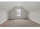Upstairs bedroom features carpeted floors and a window with an outside view at 772 Opal Wing St, Moncks Corner, SC 29461