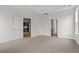 Spacious bedroom features carpeted flooring and provides access to an ensuite bath and kitchen at 772 Opal Wing St, Moncks Corner, SC 29461