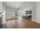 Open-concept living space boasts hardwood floors, a fireplace, and a modern kitchen with gray cabinets at 772 Opal Wing St, Moncks Corner, SC 29461