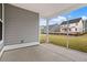 Covered back porch with a concrete floor and views of the backyard at 772 Opal Wing St, Moncks Corner, SC 29461