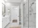 Spacious bathroom with white vanity, frameless glass shower and open doorway at 779 Forrest Dr, Charleston, SC 29492