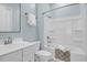 Cozy bathroom featuring a tub with shower, white vanity and blue walls at 779 Forrest Dr, Charleston, SC 29492