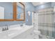 Bathroom featuring a double sink vanity, framed mirrors, a shower and tub combo at 779 Forrest Dr, Charleston, SC 29492
