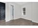 Bright bedroom with light gray walls, wood floors, and an ensuite bathroom at 779 Forrest Dr, Charleston, SC 29492