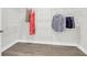Spacious walk-in closet features wooden floors and white shelving, perfect for organized storage at 779 Forrest Dr, Charleston, SC 29492