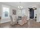 Elegant dining room with a modern chandelier and ample natural light at 779 Forrest Dr, Charleston, SC 29492