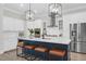 Stylish kitchen features large island with seating, modern appliances, and bright white cabinetry at 779 Forrest Dr, Charleston, SC 29492