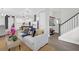 Open concept living room, kitchen, and staircase area with modern decor at 779 Forrest Dr, Charleston, SC 29492