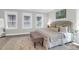 Comfortable bedroom with bench, windows, and soft lighting at 779 Forrest Dr, Charleston, SC 29492