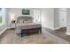 Beautiful bedroom features a padded headboard and soft rug at 779 Forrest Dr, Charleston, SC 29492