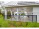 Covered poolside area with ceiling fans, open views, and a black fence offering privacy at 779 Forrest Dr, Charleston, SC 29492