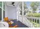 Relaxing screened-in porch with comfortable seating and a view of the lush backyard at 779 Forrest Dr, Charleston, SC 29492