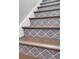 Elegant staircase featuring beautiful decorative tile risers at 779 Forrest Dr, Charleston, SC 29492