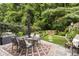Beautiful backyard with a dining table, lush greenery, and a cozy atmosphere at 826 Bibury Ct, Charleston, SC 29414