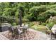 Beautiful backyard with a dining table, lush greenery, and a cozy atmosphere at 826 Bibury Ct, Charleston, SC 29414