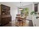 Dining room with wood table and chairs, a hutch, and a window overlooking the backyard at 826 Bibury Ct, Charleston, SC 29414