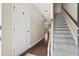 Inviting foyer with hardwood floors, staircase, and access to other rooms in the home at 826 Bibury Ct, Charleston, SC 29414