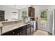Spacious kitchen area with granite countertops, stainless steel appliances, and natural light at 826 Bibury Ct, Charleston, SC 29414