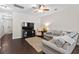 Bright living room featuring dark hardwood flooring, neutral paint and a cozy sectional sofa at 826 Bibury Ct, Charleston, SC 29414
