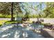 Spacious backyard featuring a concrete patio with fire pit and various seating arrangements at 8562 N Highway 17, McClellanville, SC 29458