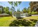 Spacious backyard with a cozy patio, ideal for outdoor gatherings and relaxation at 8562 N Highway 17, McClellanville, SC 29458