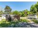Backyard view with a fence and blooming roses, offers a charming outdoor space at 8562 N Highway 17, McClellanville, SC 29458
