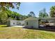 A well-maintained backyard features a patio and a covered area with outdoor seating, perfect for entertaining at 8562 N Highway 17, McClellanville, SC 29458