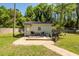 Charming backyard featuring a cozy deck, grill, and well-maintained lawn at 8562 N Highway 17, McClellanville, SC 29458