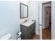 Bathroom with stylish vanity, framed mirror, and convenient toilet paper holder at 8562 N Highway 17, McClellanville, SC 29458