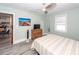 This is a bedroom that flows into the kitchen with a TV and beach-themed art at 8562 N Highway 17, McClellanville, SC 29458