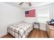 Bright bedroom with minimalist style, showcasing comfort and functionality with an American flag on the wall at 8562 N Highway 17, McClellanville, SC 29458