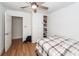 Comfortable bedroom featuring a ceiling fan, closet, and wood-look flooring at 8562 N Highway 17, McClellanville, SC 29458