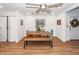 Dining room with a wood table, bench, blue chairs, and an overhead ceiling fan at 8562 N Highway 17, McClellanville, SC 29458