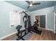 This exercise room features vinyl flooring and a full home gym setup at 8562 N Highway 17, McClellanville, SC 29458