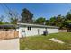 The side of the light green house features an AC unit, electrical components, and access to the backyard at 8562 N Highway 17, McClellanville, SC 29458