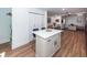 Modern kitchen boasts a quartz island, sleek cabinetry, and an open layout perfect for entertaining at 8562 N Highway 17, McClellanville, SC 29458