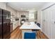 Eat-in kitchen with gray cabinets, stainless steel appliances, and a white quartz island at 8562 N Highway 17, McClellanville, SC 29458