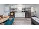 Modern kitchen with stainless steel appliances, ample counter space, and adjacent washer/dryer at 8562 N Highway 17, McClellanville, SC 29458