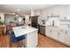 Bright kitchen with stainless steel appliances, white cabinets, quartz counters, and island at 8562 N Highway 17, McClellanville, SC 29458