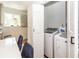Convenient laundry room with modern washer and dryer units adjacent to the kitchen at 8562 N Highway 17, McClellanville, SC 29458