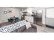 Open-concept living space with a modern kitchen, dining area, and comfortable seating at 8562 N Highway 17, McClellanville, SC 29458